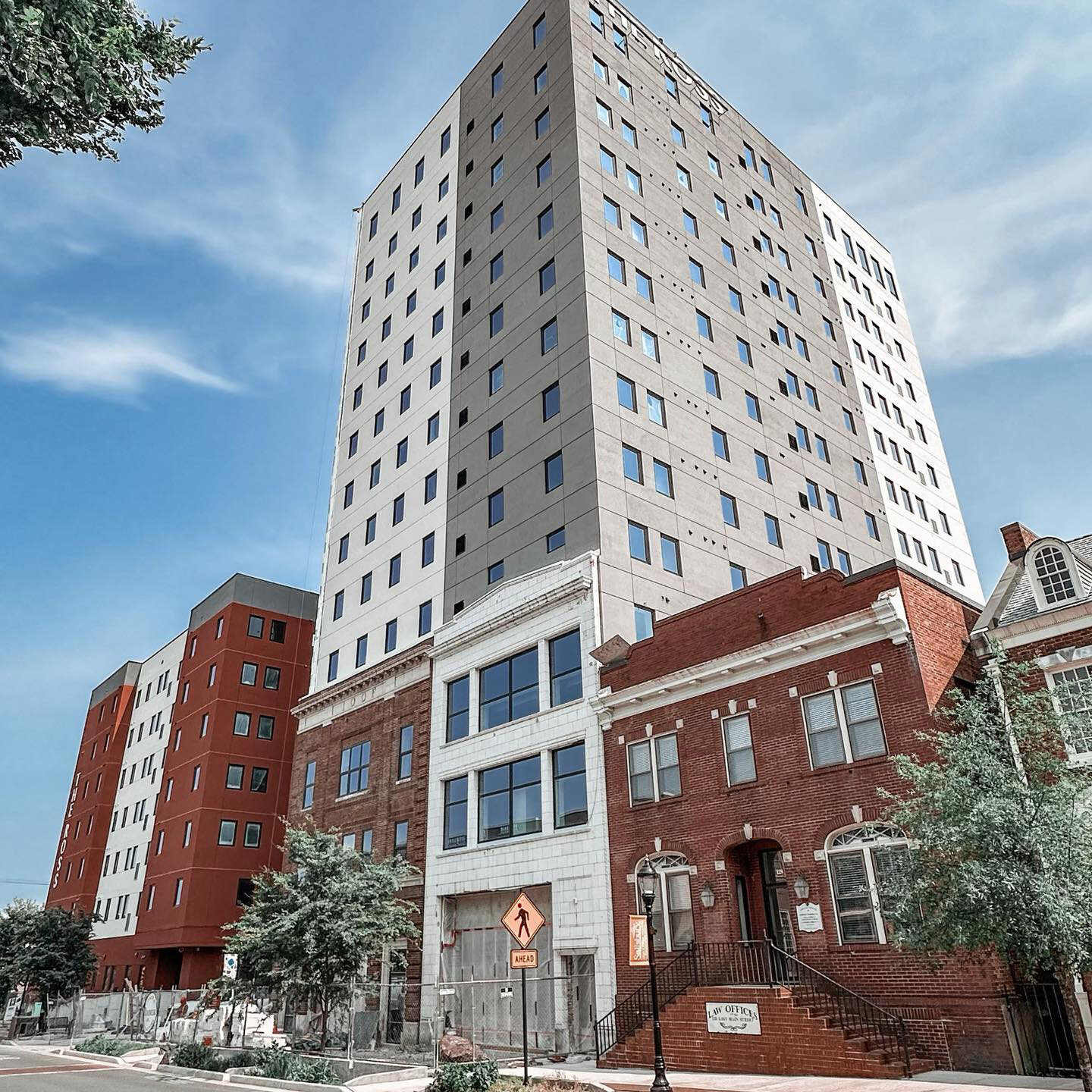 a very tall building sitting on the corner of a street